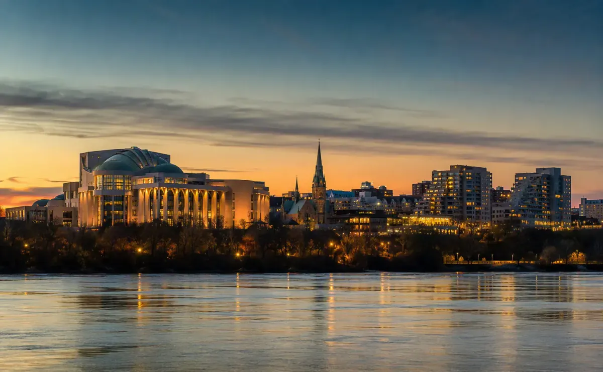 Gatineau skyline across the Ottawa River glowing at dusk